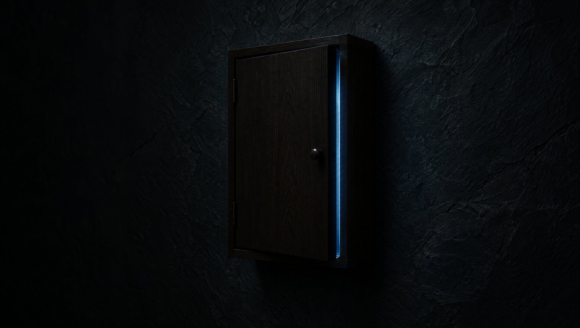 A small dark wooden wall cabinet on a dark slate wall, its door slightly open, a thin line of cool slate-blue light glowing from the gap.